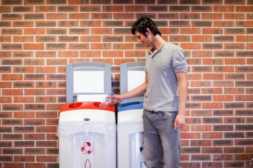 Workers loading cubic-yard measurements of office waste into a vehicle